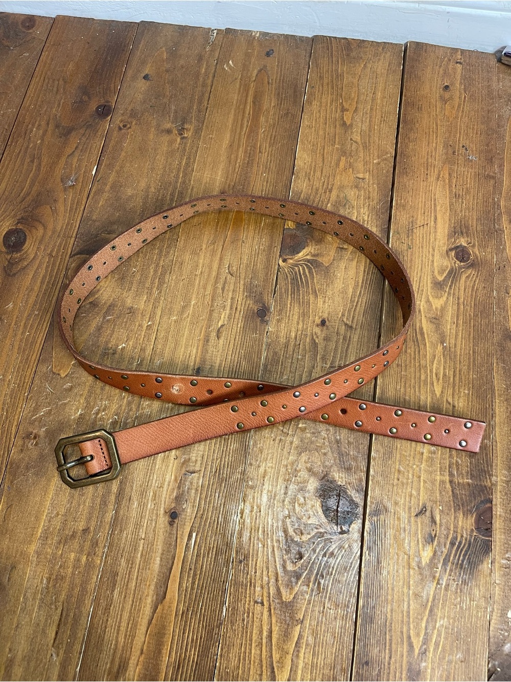 Nine waist women’s size medium tan leather belt with studs
